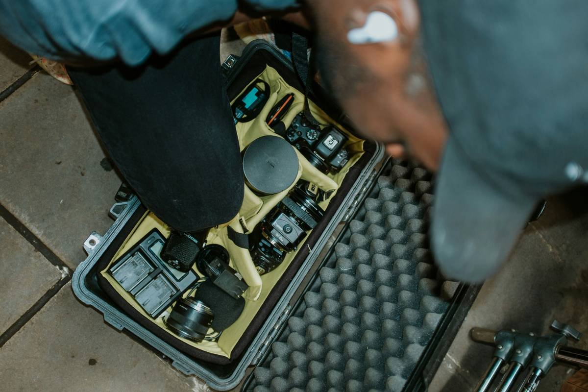 A climber inspecting their gloves before a climb