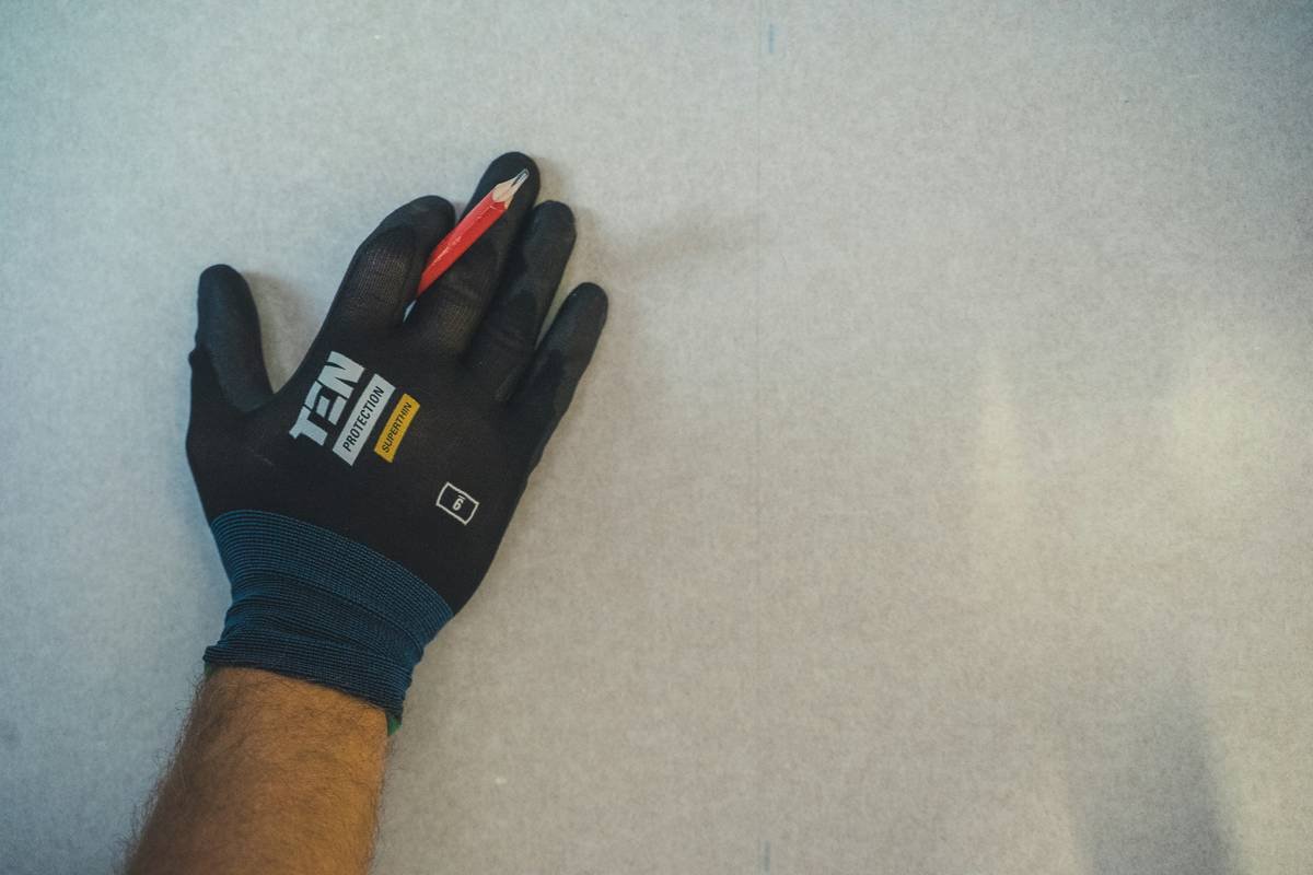 A close-up of high-quality grip gloves designed for exercise showing textured palm pads